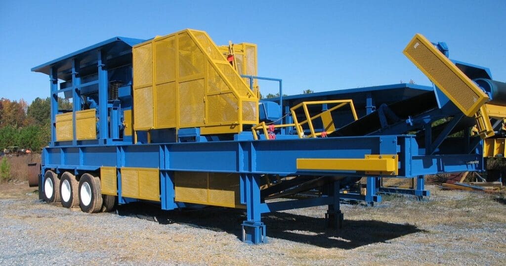 Large blue and yellow industrial portable jaw plant